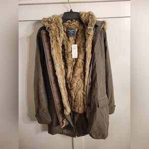 Two piece jacket, shell with reversible vest